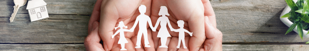 paper doll cut out of family held in hands open