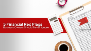 Desk with calculator, coffee, clock, financial red flags and financial records