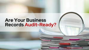 files and a magnifying glass with text are your business records audit-ready